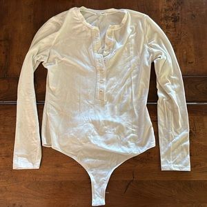 Reformation white henley style body suit. Size Large